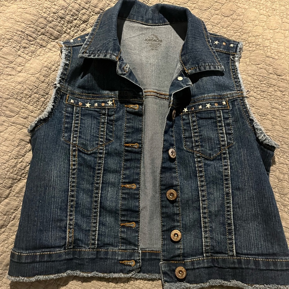 Girls Jean vest with rough seams and blingy accents.